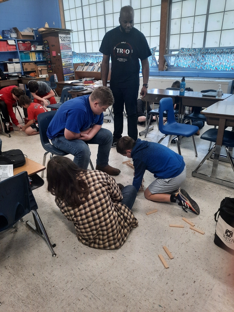 James with TRIO is doing a STEM activity using keva planks with the 6th graders.